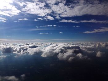 Aerial view of sea against cloudy sky