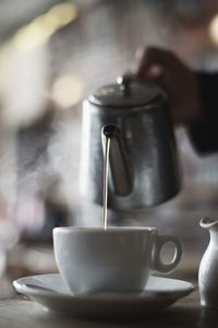 Close-up of coffee cup on table