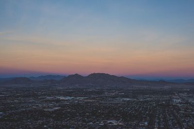 Scenic view of mountains against sky during sunset