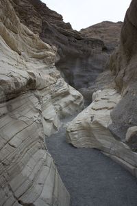 Narrow pathway along rocky walls