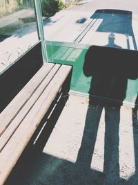 Shadow of man on road