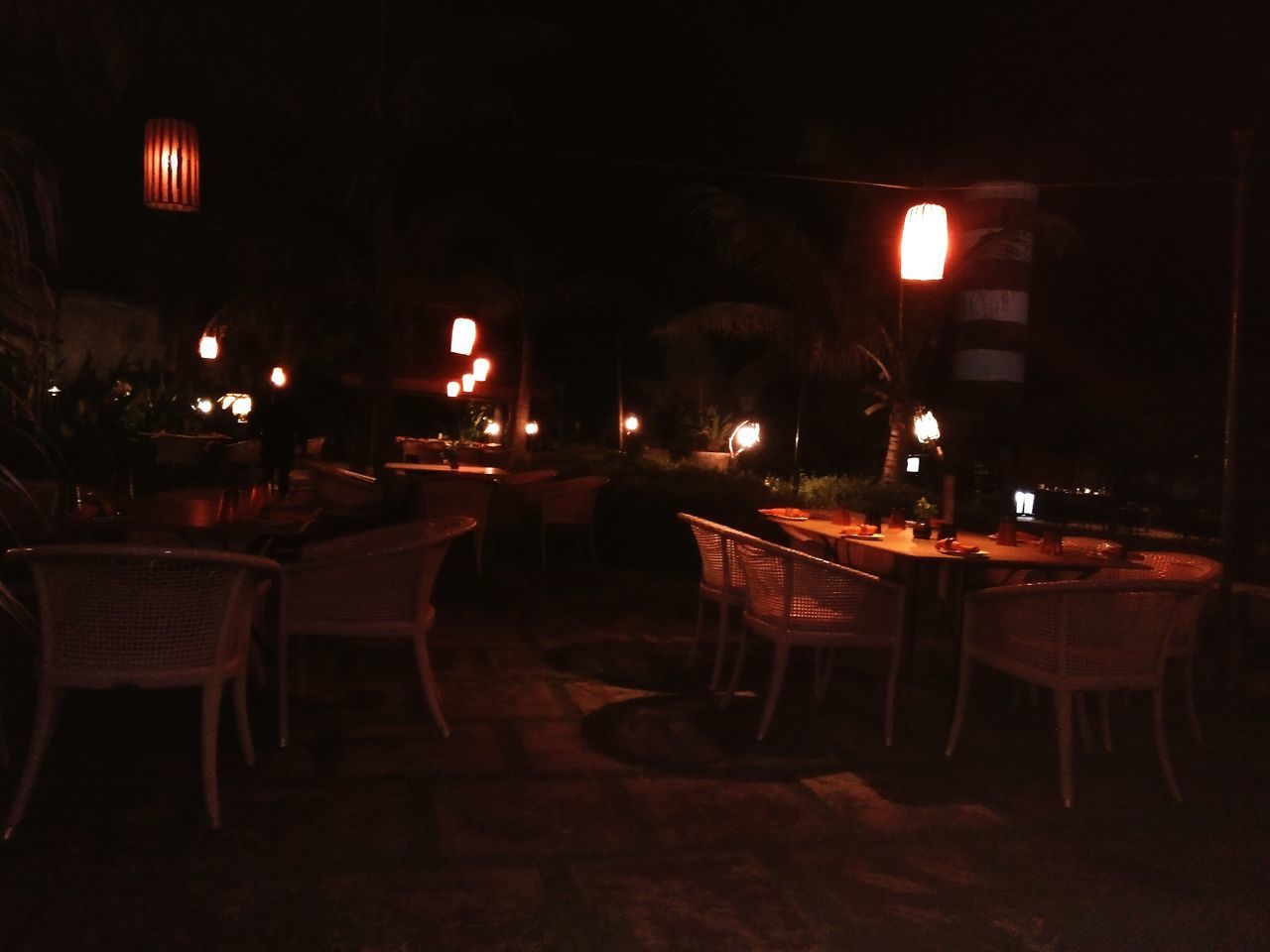 EMPTY CHAIRS AND TABLES IN RESTAURANT