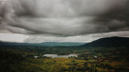 Scenic view of mountains against cloudy sky