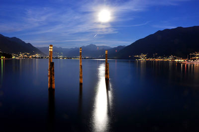 Scenic view of lake against sky at night