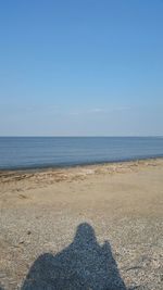 Scenic view of sea against blue sky