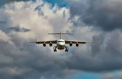 Low angle view of airplane flying in sky