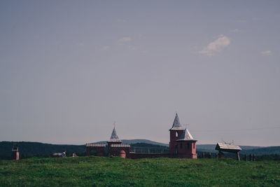 House on field against sky