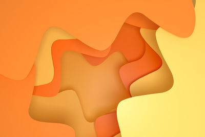 Close-up of illuminated lamp against orange background