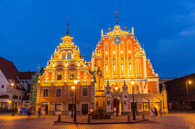 View of illuminated building against sky at dusk