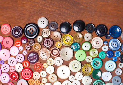 High angle view of various buttons on table