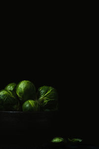 Close-up of bell peppers against black background