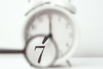 Close-up of clock against white background