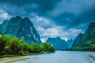 Scenic view of mountains against dramatic sky