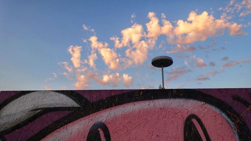 Low angle view of car on field against sky