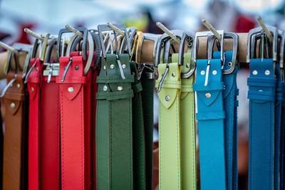 Close-up of colorful belts hanging for sale