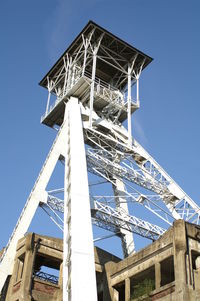 Low angle view of tower against clear blue sky