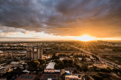 High angle view of townscape against sky during sunset