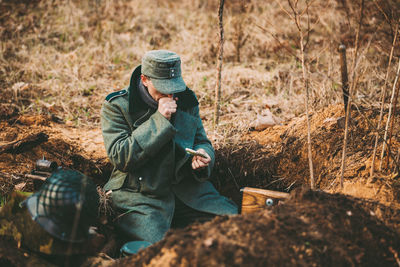 Man sitting on field