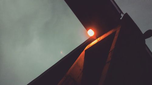 Low angle view of illuminated built structure against sky