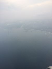 View of calm sea against cloudy sky