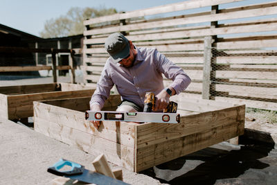 Carpenter drilling wood