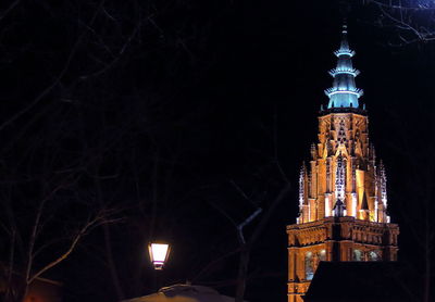 Low angle view of illuminated tower at night