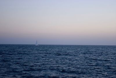 Scenic view of sea against clear sky during sunset