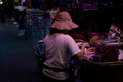 Rear view of people at street market