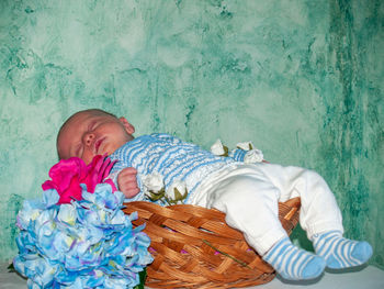 High angle view of boy sleeping on bed