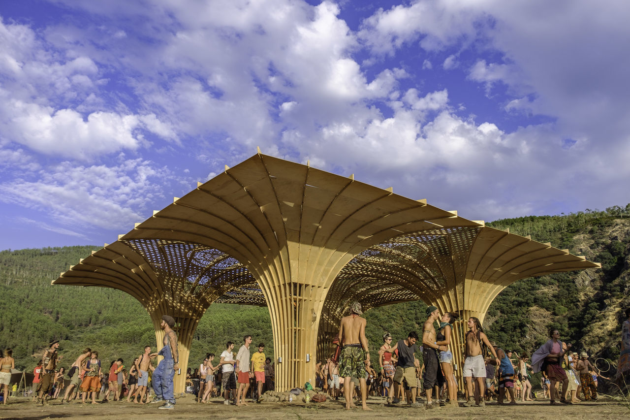 large group of people, person, sky, leisure activity, tourism, men, cloud - sky, travel, tourist, travel destinations, vacations, outdoors, cloudy, day, pyramid, modern, famous place, architectural feature, crowd