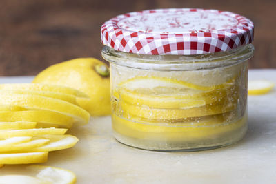 Close-up of drink in glass jar on table