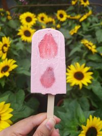 Close-up of hand holding ice cream cone