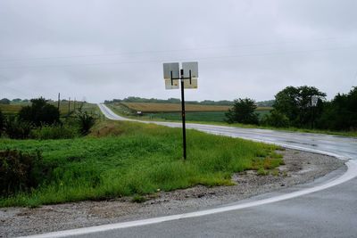 Road by street against sky