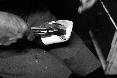 Close-up of man working on metal