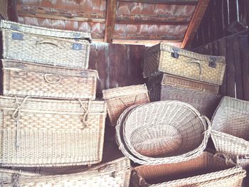 Homemade wicker baskets against wooden wall