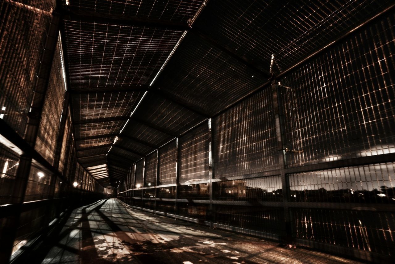 transportation, the way forward, indoors, railroad track, illuminated, diminishing perspective, built structure, architecture, rail transportation, vanishing point, tunnel, ceiling, railroad station, public transportation, railroad station platform, night, empty, no people, lighting equipment, long