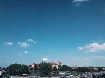 View of townscape against blue sky