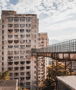 View of buildings against cloudy sky