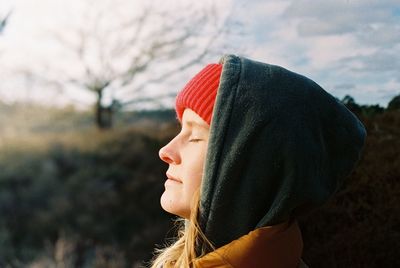 Close-up portrait of woman wearing hat