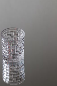 Close-up of glass stack against black background