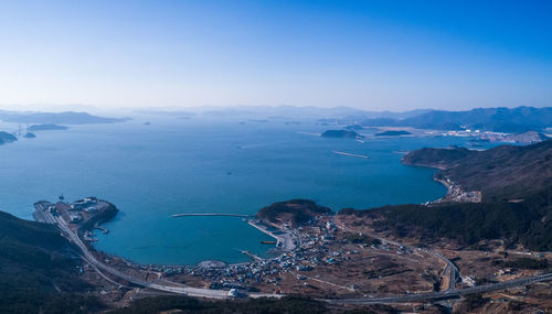 High angle view of sea against clear blue sky