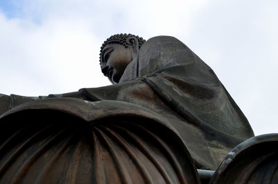 Low angle view of statue against sky