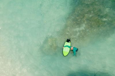 High angle view of person paragliding in swimming pool