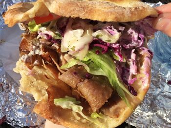 Close-up of hand holding burger