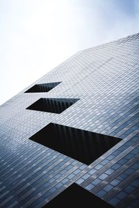 Low angle view of skyscraper against sky