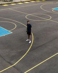 High angle view of man standing on basketball court