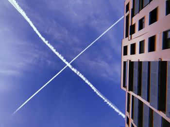 Low angle view of building against blue sky