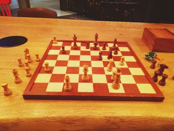 High angle view of chess pieces on table