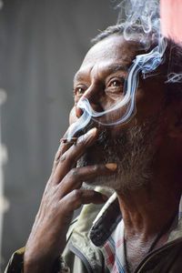 Close-up of man smoking cigarette