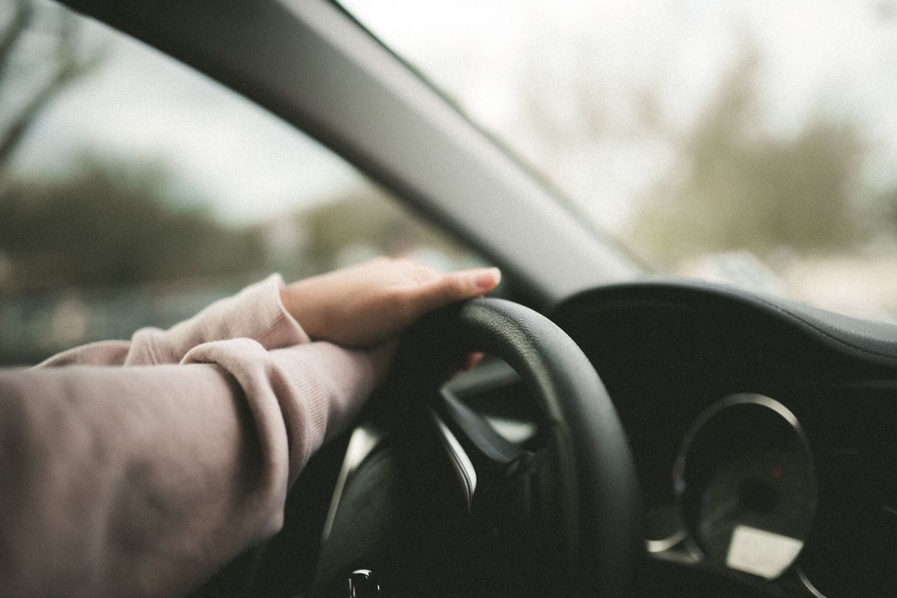 human hand, human body part, transportation, car, mode of transport, vehicle interior, car interior, land vehicle, human finger, steering wheel, close-up, one person, real people, dashboard, driving, gearshift, indoors, men, day, people, gauge, adult, adults only